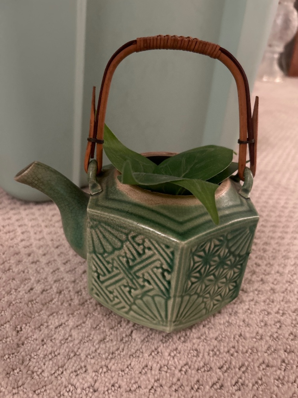 Antique watering can vase